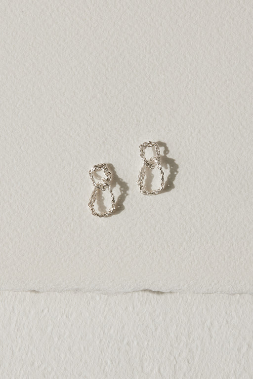 Silver drop earrings with two interlocking circles by Camillette Jewelry